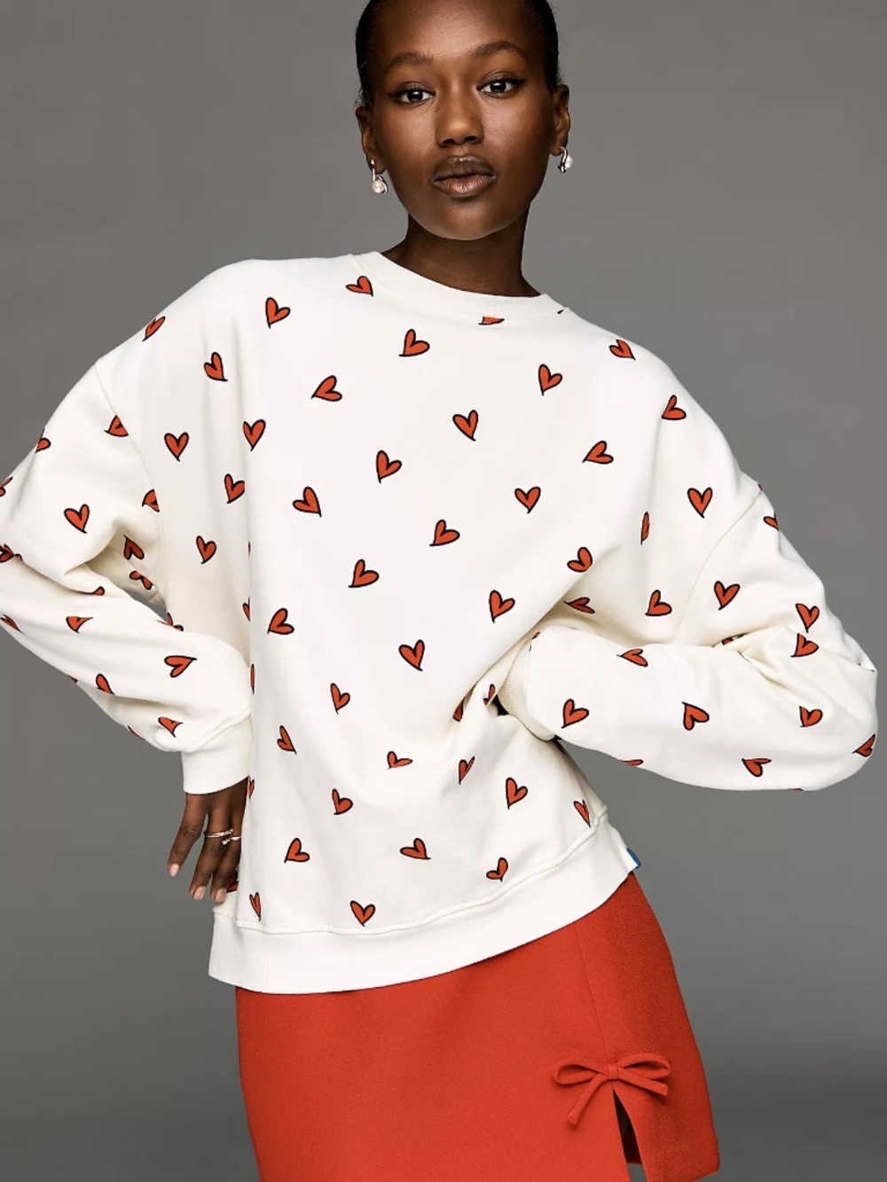 Anthropologie KULE The Oversized Allover Heart Sweatshirt Top size S nwt